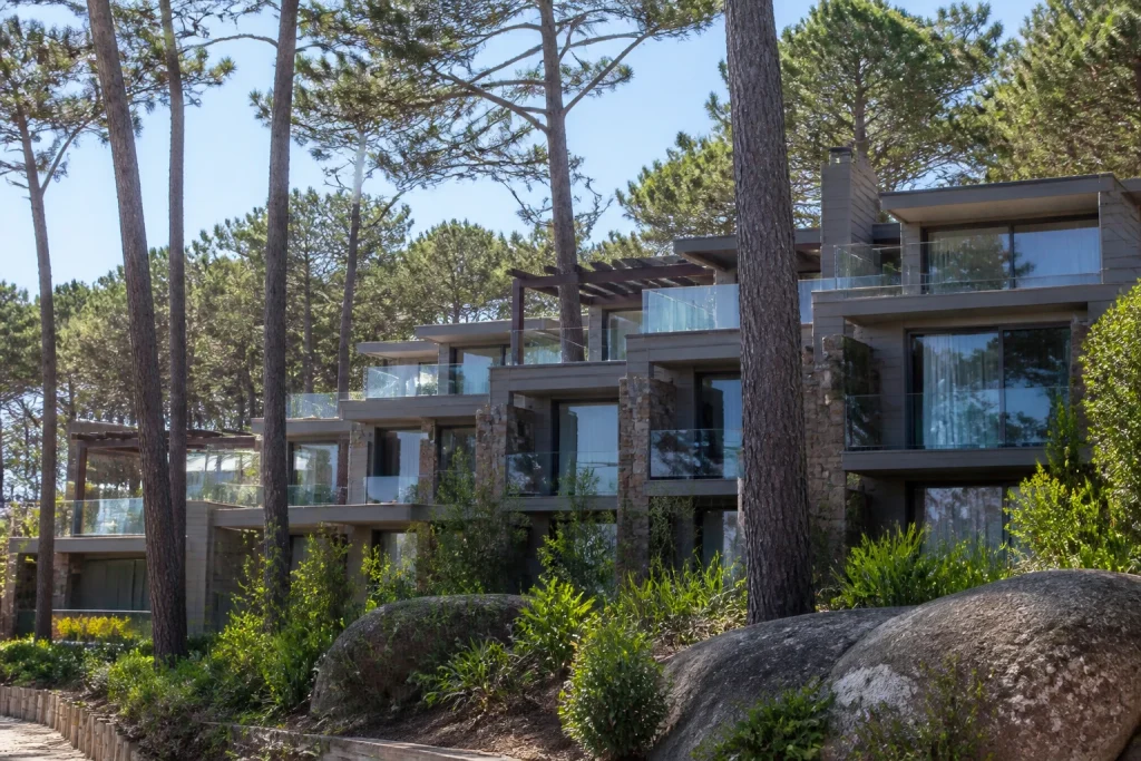 Il Belvedere resort buildings among pine forest and native vegetation