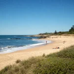 Sandy shoreline and ocean at Bikini Beach near Manantiales, Uruguay