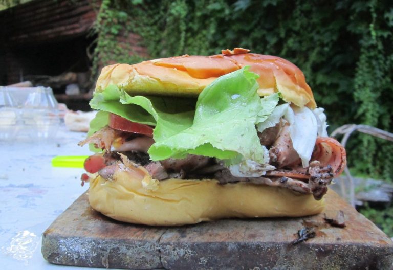 Real photograph of a homemade Uruguayan chivito sandwich