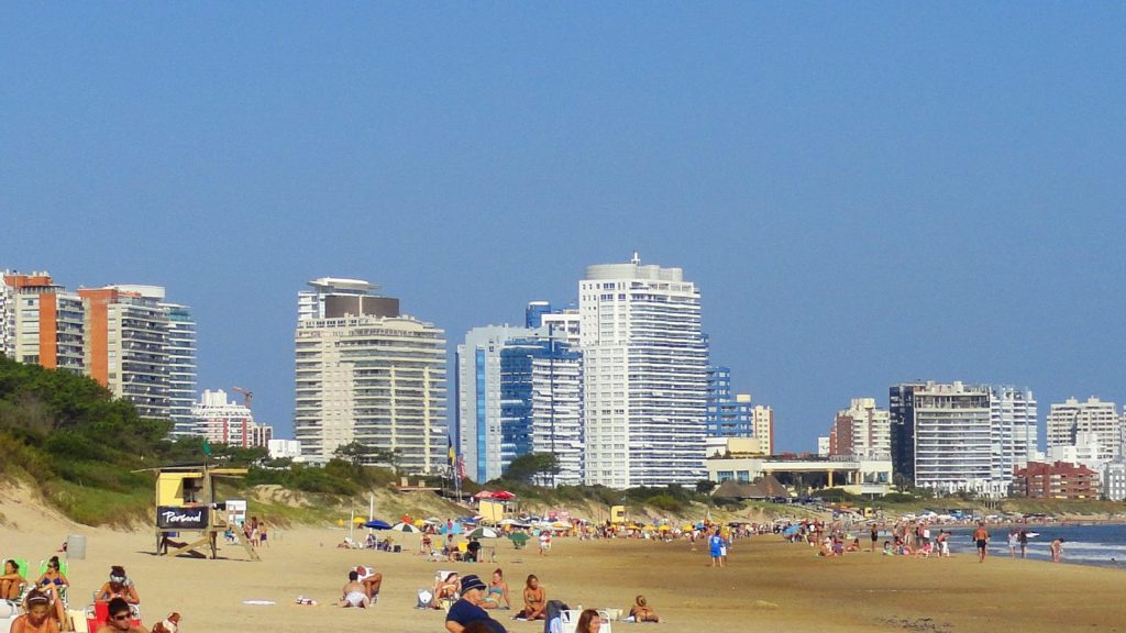 Real photograph of Playa Mansa with Punta del Este hotels and beachgoers