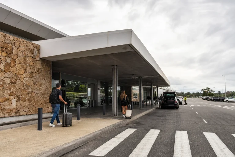 Travelers with luggage outside Punta del Este Airport