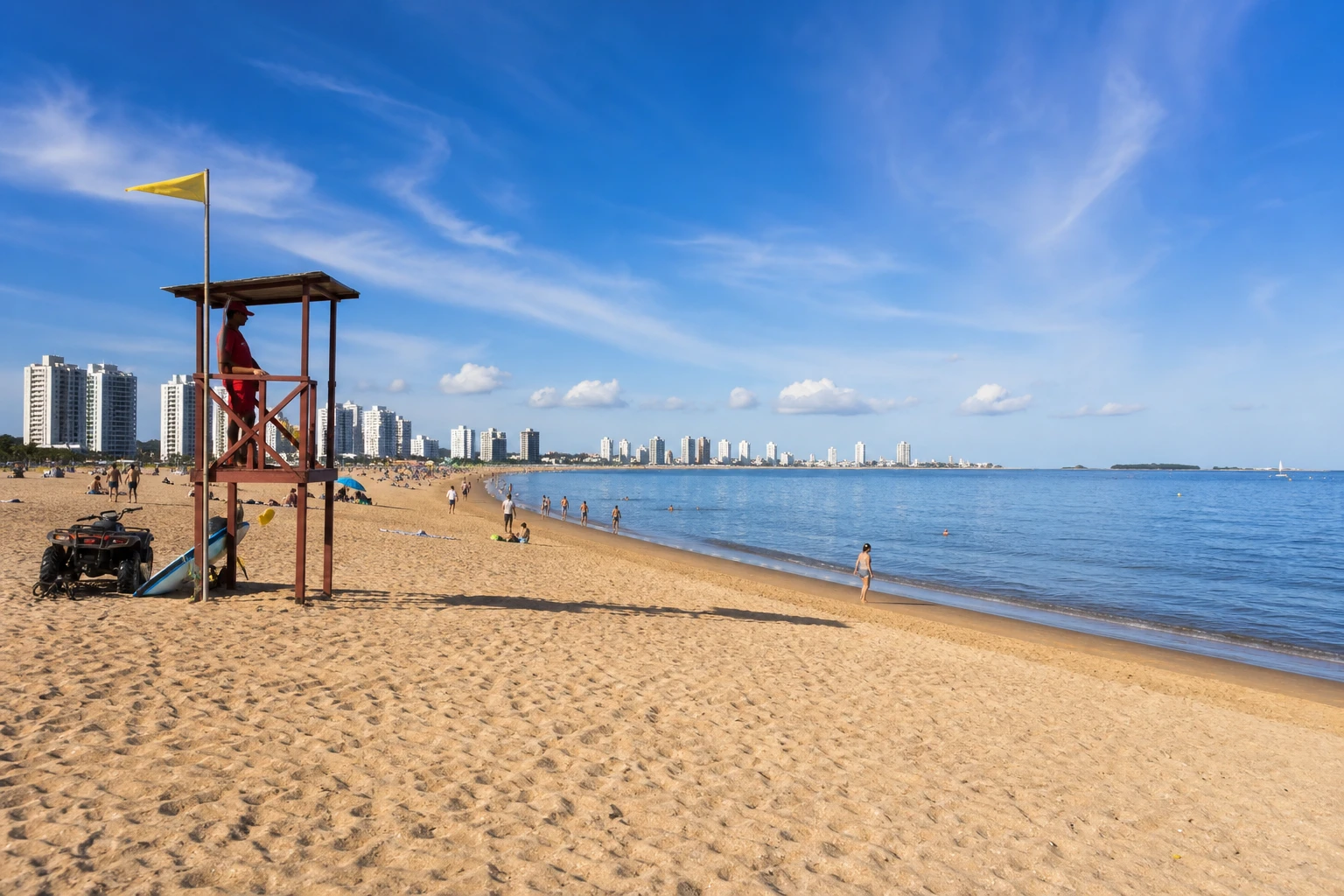 Lifeguard tower above the sandy shoreline at Playa Mansa in Punta del Este.