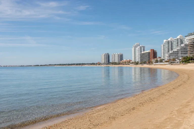 Broad sandy shoreline and calm water at Playa Mansa in Punta del Este