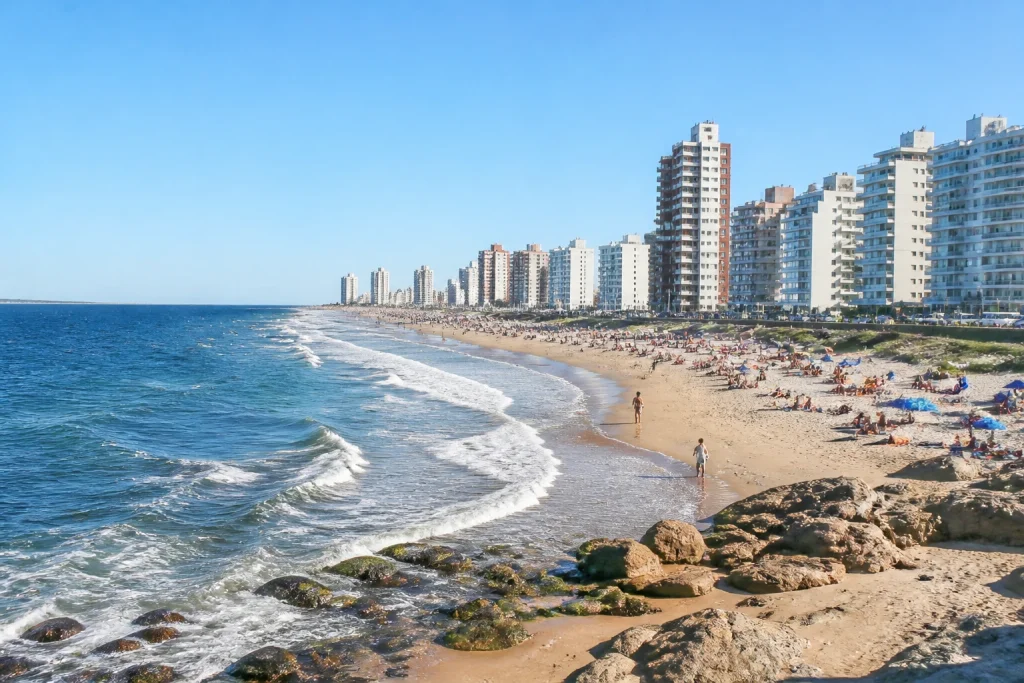 Sandy summer beach and coastal water in Punta del Este